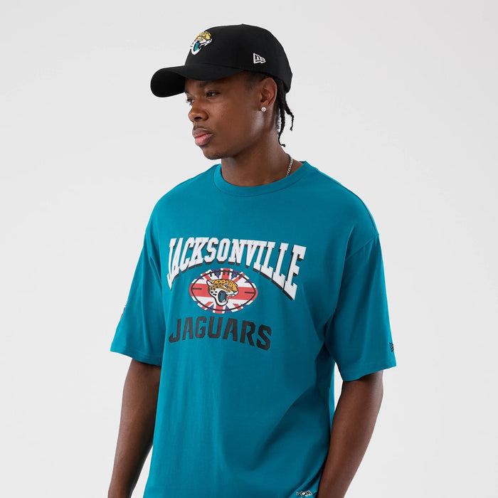 The Male model is wearing Jacksonville Jaguars NFL International Series Games Turquoise Oversized T-Shirt 7
