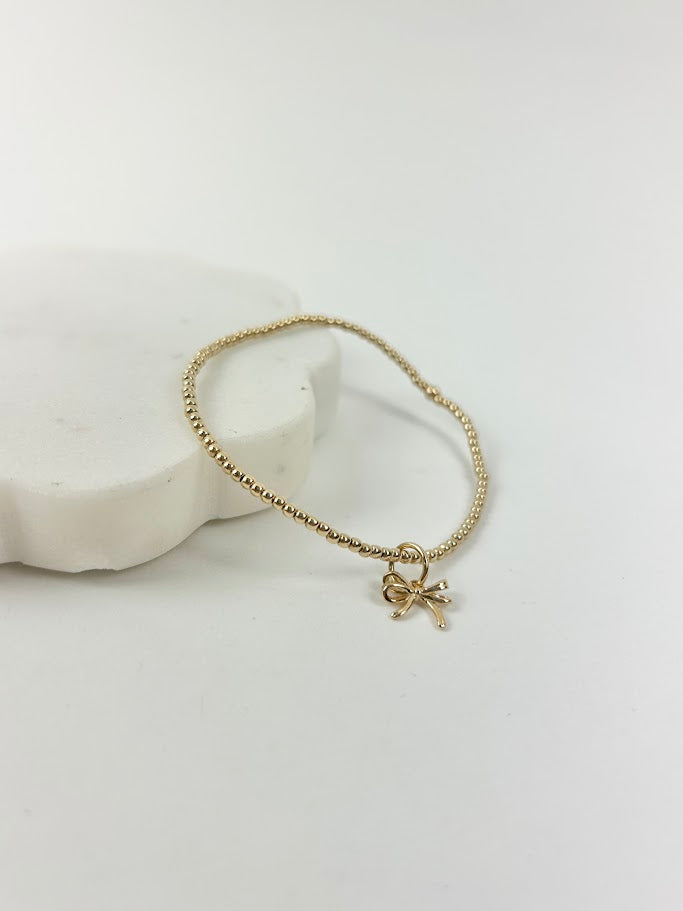 Beaded Blondes Bow Charm Bracelet Bracelets in at Wrapsody