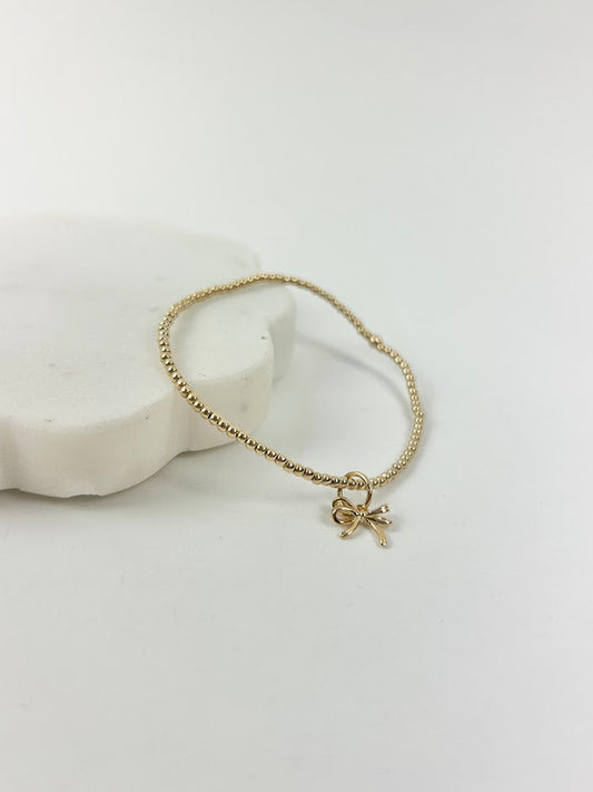 Beaded Blondes Bow Charm Bracelet Bracelets in at Wrapsody