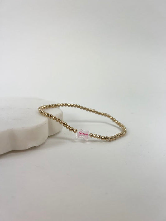 Beaded Blondes Pink Bow Charm Bracelet Bracelets in at Wrapsody