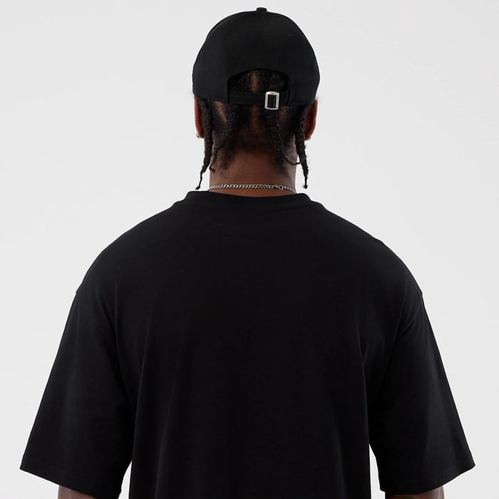 The Male model is wearing Berlin NFL International Series Games Black Oversized T-Shirt 7