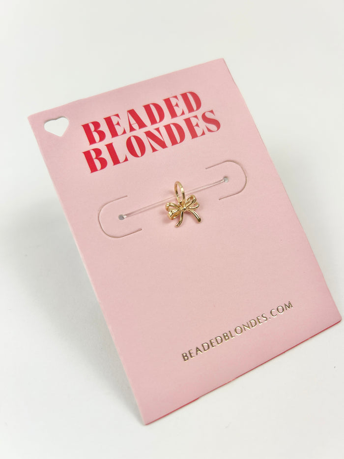 Interchangeable Gold Bow Charm Necklaces in at Wrapsody