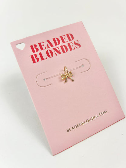 Interchangeable Gold Bow Charm Necklaces in at Wrapsody