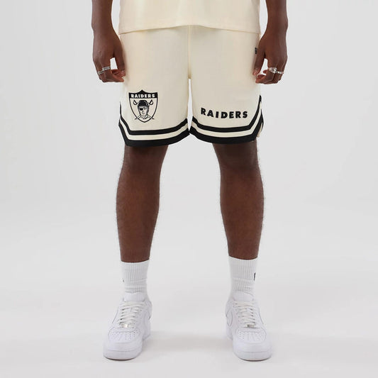 The model is wearing these NFL Historic Las Vegas Raiders shorts in cream. 1