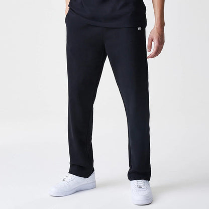 The Male model is wearing New Era Premium Essential Black Joggers 1
