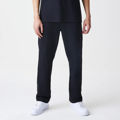 The Male model is wearing New Era Premium Essential Black Joggers 3