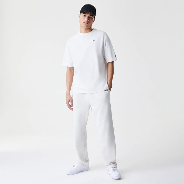 The Male model is wearing New Era Premium Essential Pastel Grey Joggers 8