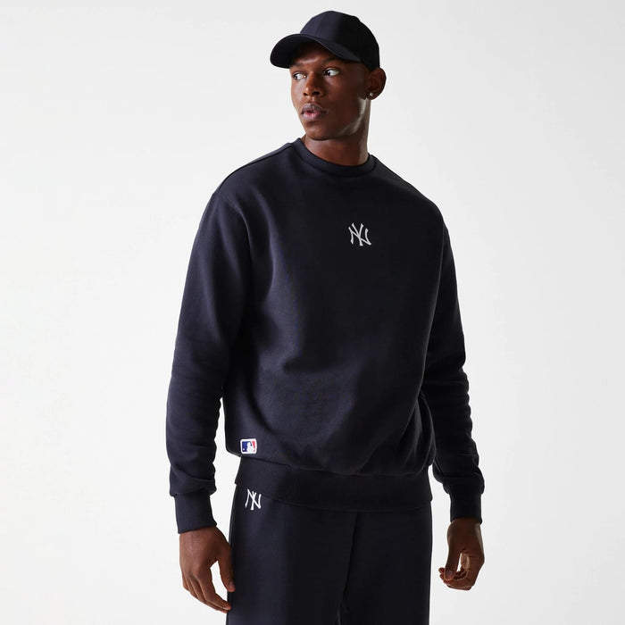The Male model is wearing New York Yankees MLB League Essential Navy Crew Neck Sweater 1