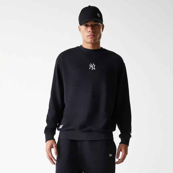 The Male model is wearing New York Yankees MLB League Essential Midi Black Oversized Crew Neck Sweater 1