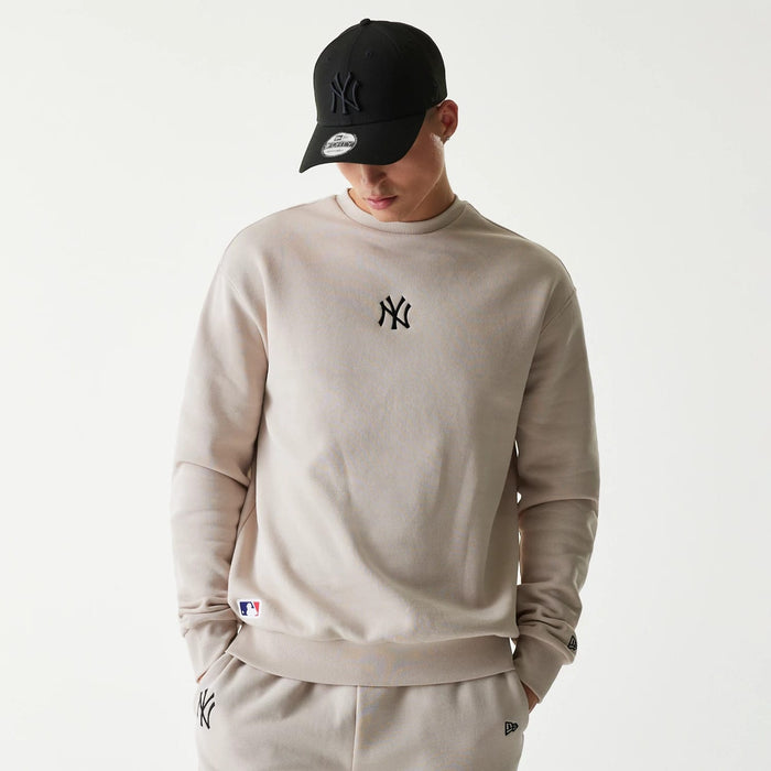 The Male model is wearing New York Yankees MLB League Essential Midi Cream Oversized Crew Neck Sweater 1