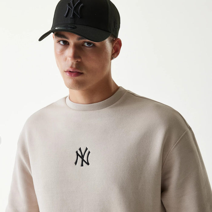 The Male model is wearing New York Yankees MLB League Essential Midi Cream Oversized Crew Neck Sweater 4