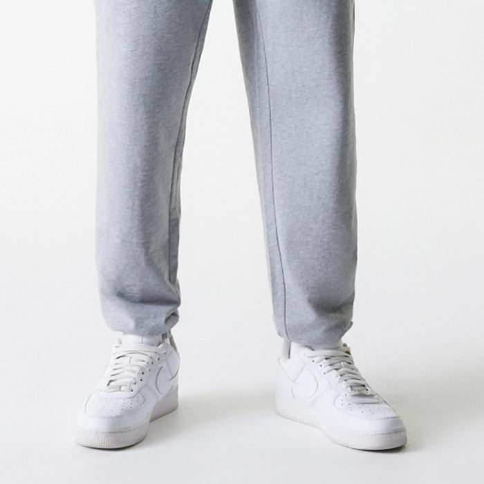 The Male model is wearing New York Yankees MLB League Essential Midi Grey Joggers 3