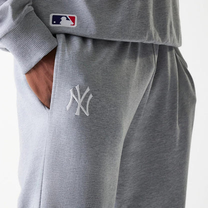 The Male model is wearing New York Yankees MLB League Essential Midi Grey Joggers 4
