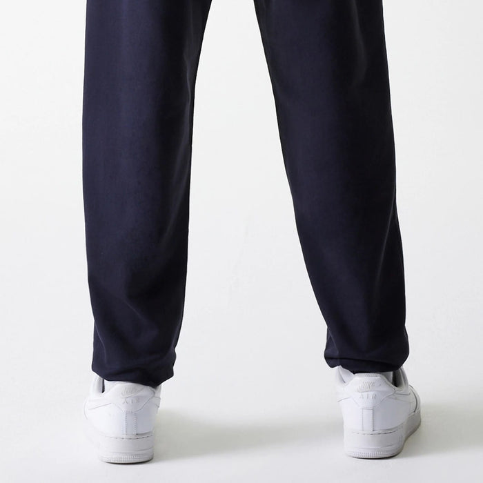The Male model is wearing New York Yankees MLB League Essential Midi Navy Joggers 7