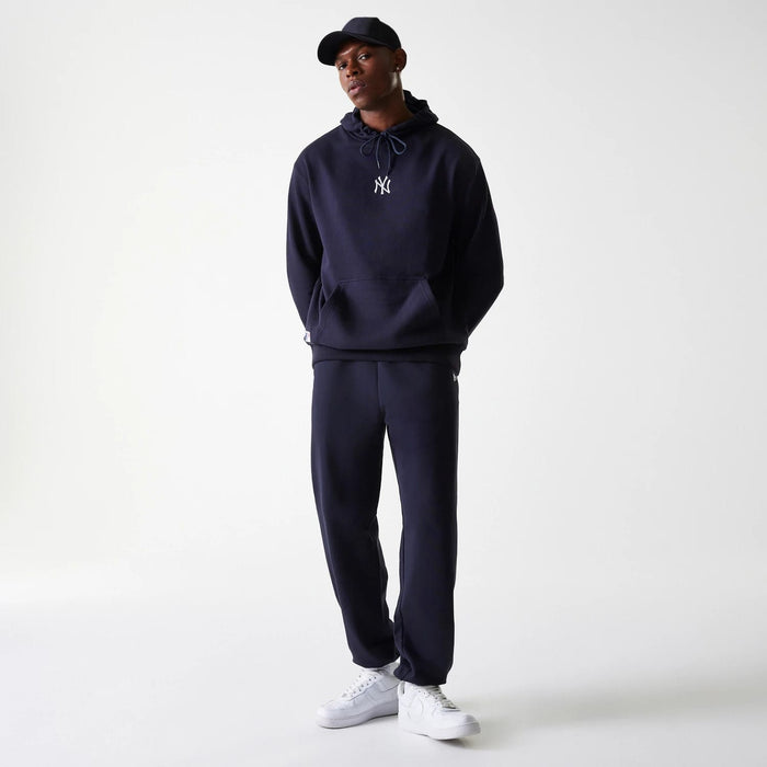 The Male model is wearing New York Yankees MLB League Essential Midi Navy Joggers 8