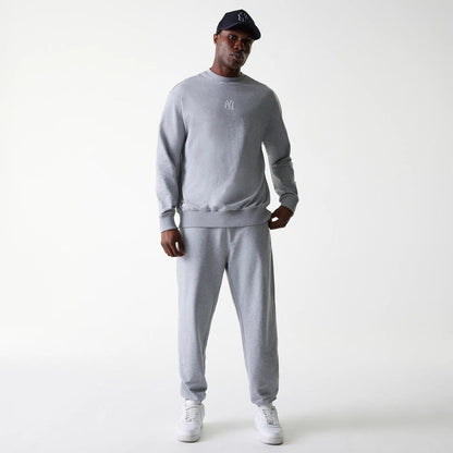 The Male model is wearing New York Yankees MLB League Essential Midi Grey Oversized Crew Neck Sweater 7