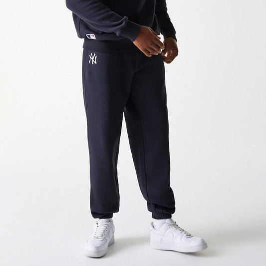 The Male model is wearing New York Yankees MLB League Essential Navy Joggers 1