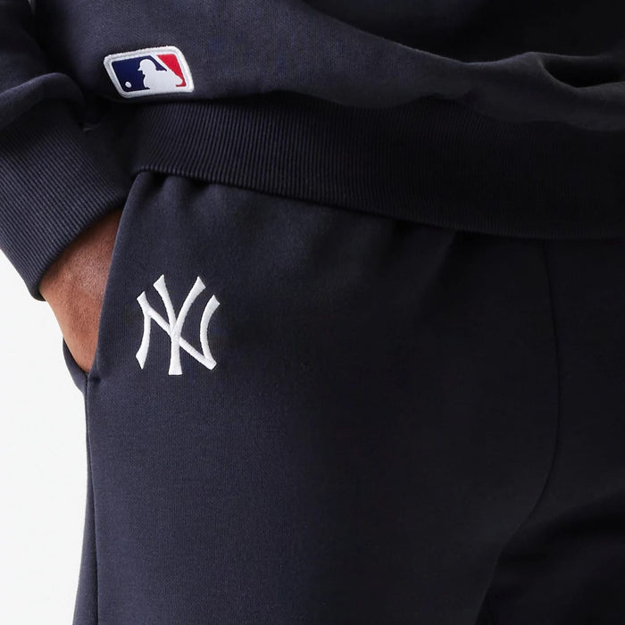 The Male model is wearing New York Yankees MLB League Essential Navy Joggers 4