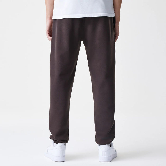 The Male model is wearing New York Yankees MLB Midi League Essential Dark Brown Joggers 2