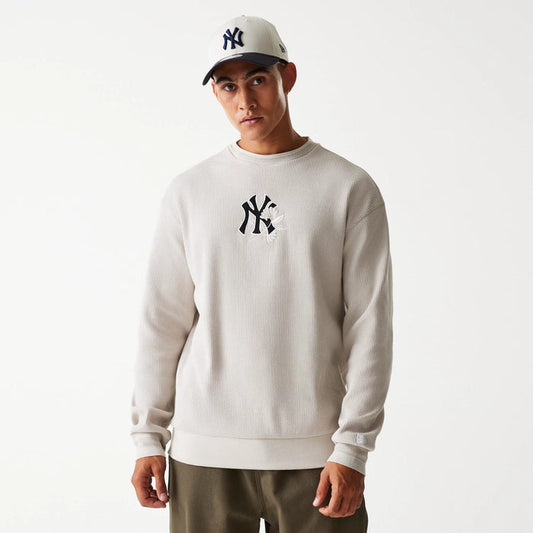 The Male model is wearing New York Yankees MLB Waffle Cream Oversized Crew Neck Sweater 1